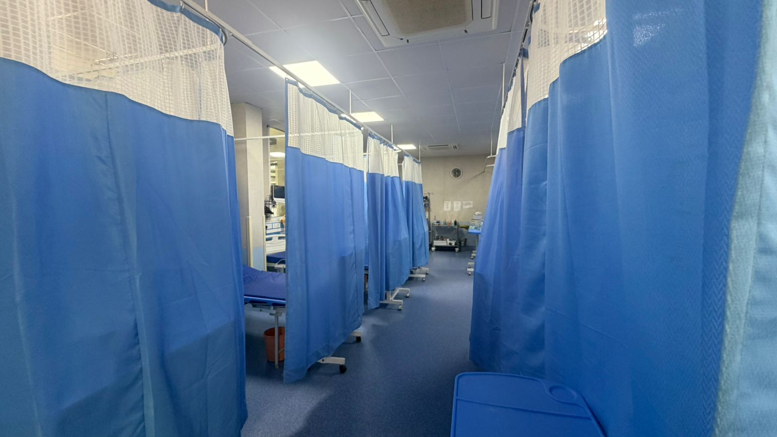 Emergency care area with privacy curtains.